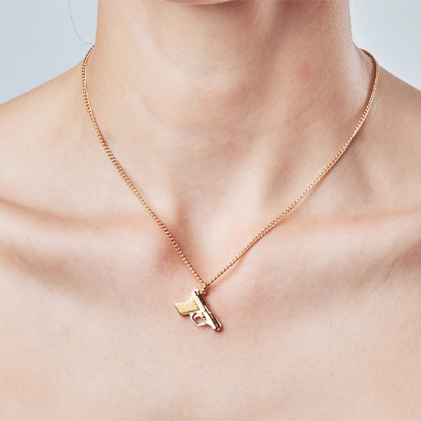 Gold gun hotsell necklace pendant